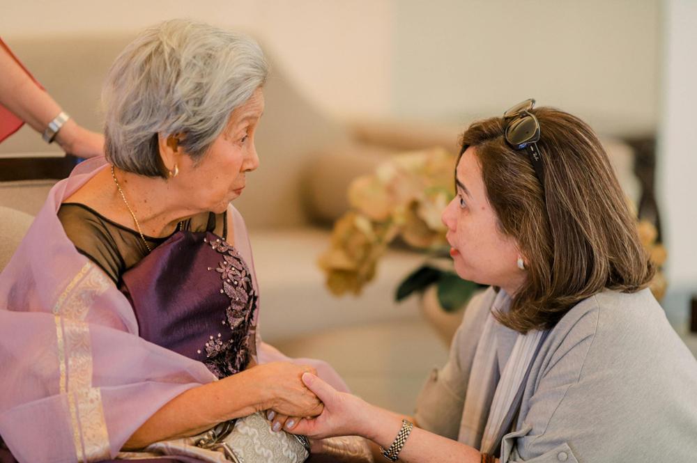 A carer talking with an older woman